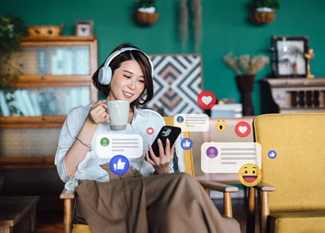 Woman using phone with reactions